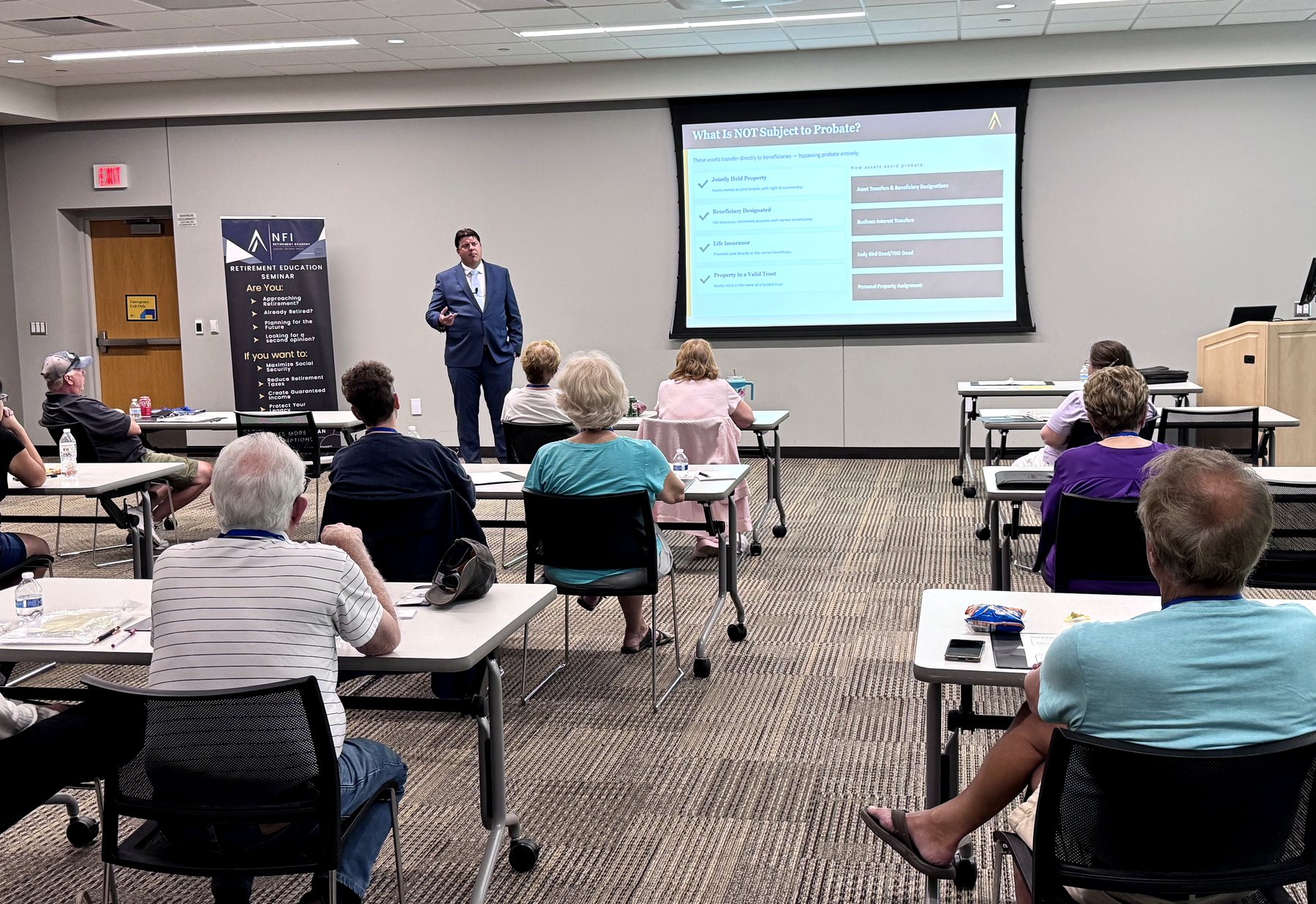 Educator presenting a retirement education topic to a seminar room